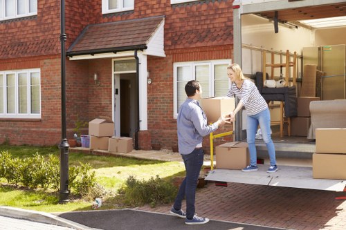 A moving team handling a home removal in the Romford area