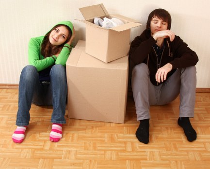Furniture being carried through a residential building in Romford