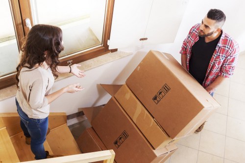 A removals team handling a flat move with stairs in Romford