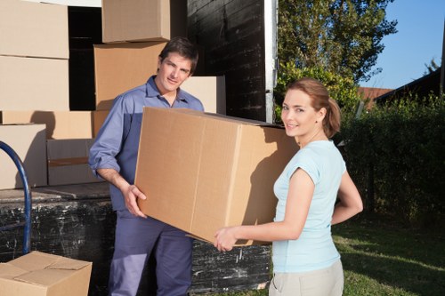 Packed boxes and furniture prepared for house removal services